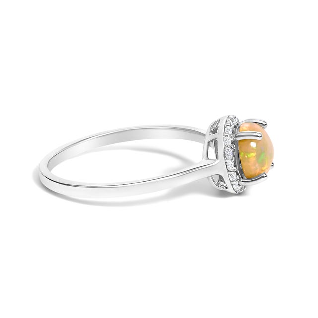 Adorn your hand with the splendor of rich, velvety captured in a mesmerizing 6x6 mm opal, its fiery hues deepened through...