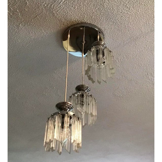 Vintage pendant lighting with hanging glass pendulums on 12" diameter chrome flush ceiling mount. Total of 36 clear glass...
