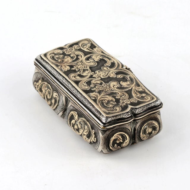 Silver snuffbox with applied gold, Baroque style. Personalized image of luxury and nobility. Observes baroque proportions,...