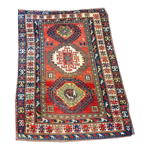 An Antique 3 Medallion Tribal Caucasian Kazak Rug