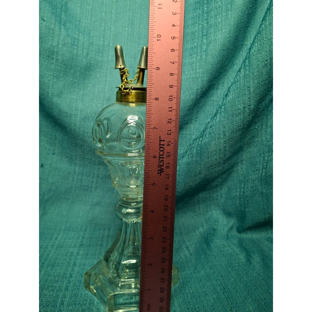 This is an exceptional example of an all-glass "wafer-joined" oil Lamp from the mid-19th century. The font is pressed in...
