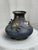 A finely cast Japanese bronze vase, likely late Meiji period (circa 1890–1910), featuring a richly textured body and...