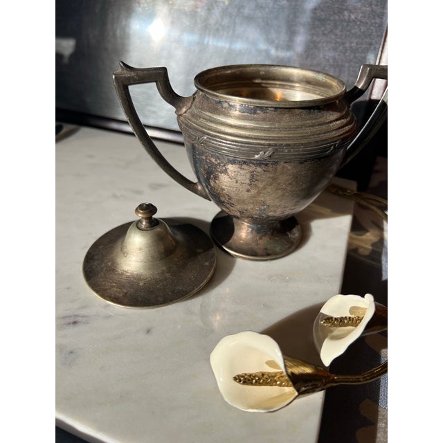 Up for consideration is a beautiful small silver trophy style catchall with matching lid. This would look lovely in your...