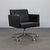 A refined pair of swivel armchairs by poltrona frau, expertly crafted in italy. Defined by their clean architectural lines...