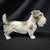 This charming German porcelain fellow shows her terrier temperament in her jaunty stance, head turned slightly to one side...