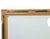 Elegant Regency Revival–style wall mirror featuring a richly detailed parcel-gilt wood frame with striking black lacquer...