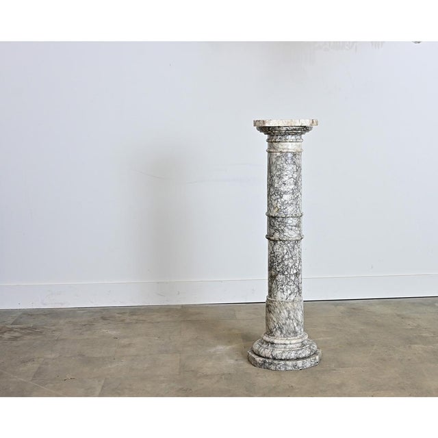 A fabulous late 19th century carved marble display pedestal from France, to elevate precious artwork, décor, or greenery...