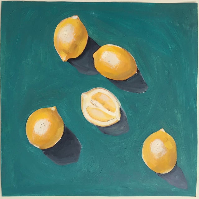 A small, unframed oil on paper study of a grouping of fresh lemons on a turquoise background. Painted by Lara Felsing.