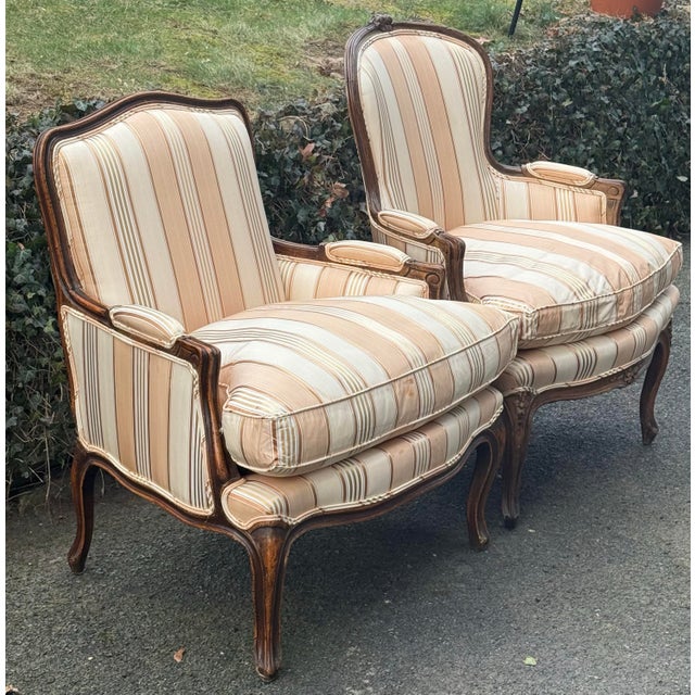 Spectacular pair of coordinated French chairs made in Italy. Features a rustic walnut frame , cabriole legs, tight back...
