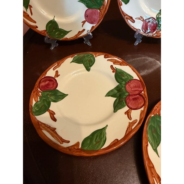 This set of 7 hand-painted Franciscan Apple Bread Plates from England features a vintage mid-century modern style with a...