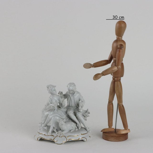 White porcelain gallant group, elegant plastic rendering. Manufacturer's mark under the base in underglaze blue. This...