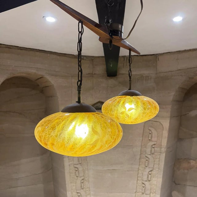 AMBIANIC presents 1960s Eugenio Escudero Chandelier Pendant Lamp Mahogany Wood modern sway bar with two-globe design....