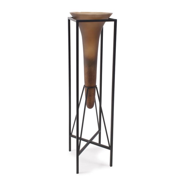 Expertly inset into a sleek flat black iron stand that seamlessly marries form and function. The bronze glass finish...