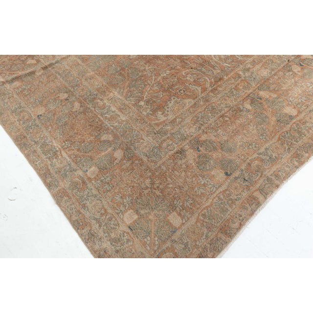 This circa-1920 antique Indian rug features an all-over design of a botanical landscape, full of tree abstractions and...