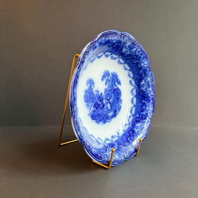 Beautiful Flow Blue "Watteau" pattern serving bowl by New Wharf Pottery dating from late 19th century. The design features...