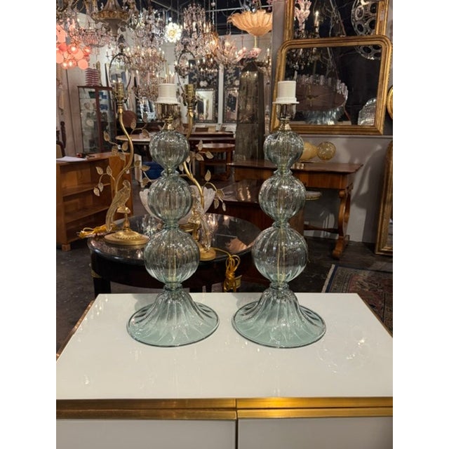 The Murano Fontana Green Glass Ball Form Lamps are a unique and stylish addition to any home or garden. Made from high-...