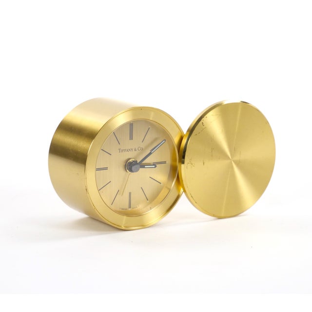 An elegant mid-20th-century small desk clock by Tiffany & Co., dating to circa 1960, featuring a refined combination of...