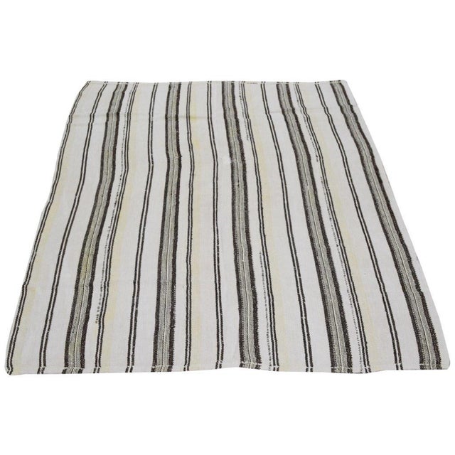 Flatweaved with care using traditional rug-making techniques, this wool rug blends timeless craftsmanship with a modern...