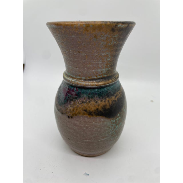 Behold the enchanting beauty of this exquisite Dirtworks glazed pottery vase, boasting a sophisticated brownish hue...
