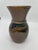 Behold the enchanting beauty of this exquisite Dirtworks glazed pottery vase, boasting a sophisticated brownish hue...