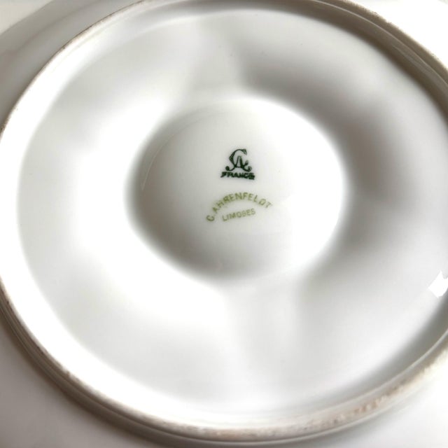 Elevate your entertaining with this elegant antique oyster plate by C. Ahrenfeldt, Limoges, France, crafted circa...