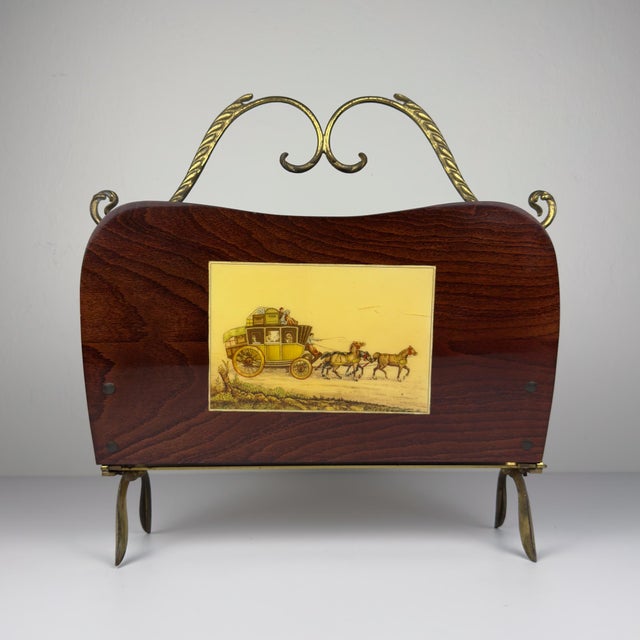 Amazing mid-century wooden and brass magazine rack. Made in Italy in the 1950s. The vintage magazine rack is in good...