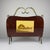 Amazing mid-century wooden and brass magazine rack. Made in Italy in the 1950s. The vintage magazine rack is in good...
