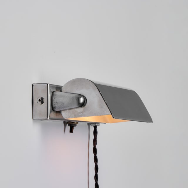 Pair of 1940s Finnish Minimalist Plug-In Wall Lights Attributed to Paavo Tynell. A highly refined pair of adjustable...