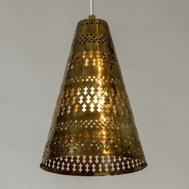 Lovley brass ceiling lamp by Hans Bergström, in a conical form. Perforated with a beautiful pattern of holes and graphic...