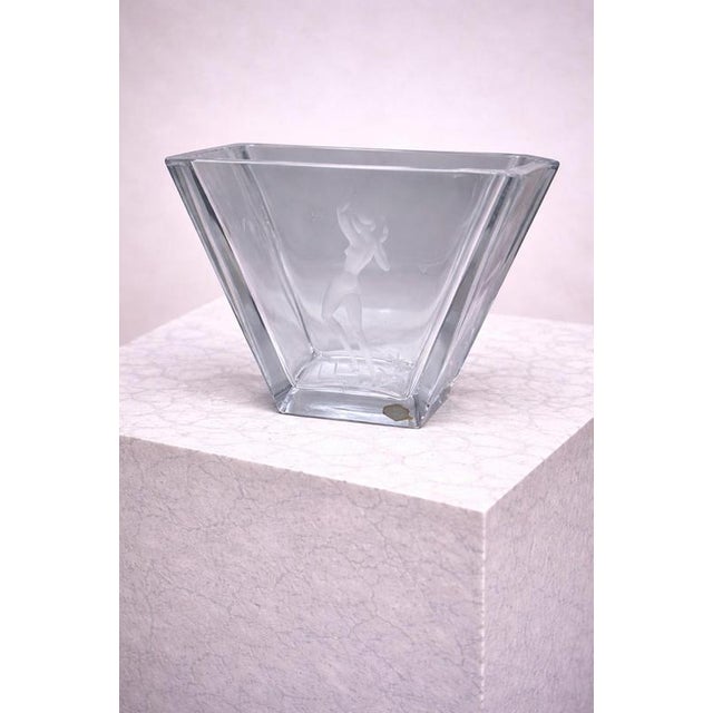 A striking and sculptural Art Deco crystal vase made by Kosta Glasbruk, Sweden, circa 1920. This elegant trapezoidal form...