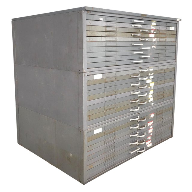 Industrial style gray painted steel flat file cabinet, commonly known as a map or blueprint cabinet. It has three...