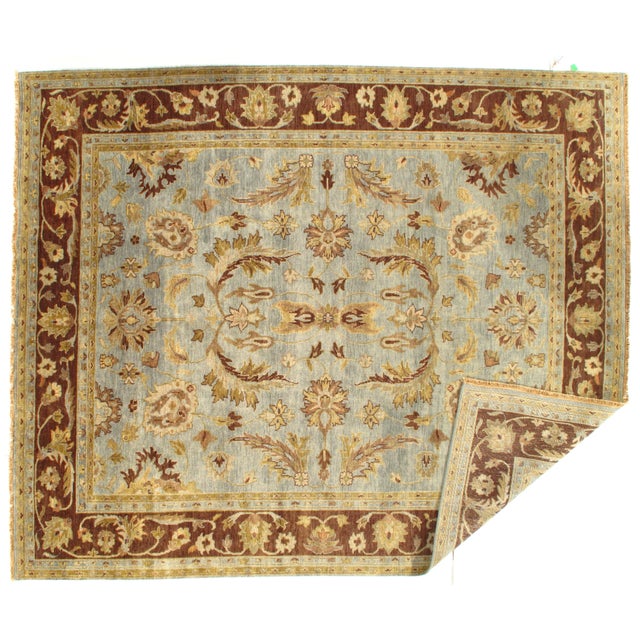 This is a hand-knotted TABRIZ design rug. The piece is made of wool and hand-spun wool from India. This rug has a dense,...