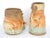 This set of artisan created earthen ware pottery vases are in the stylized forms of the American film actors Laurel and...