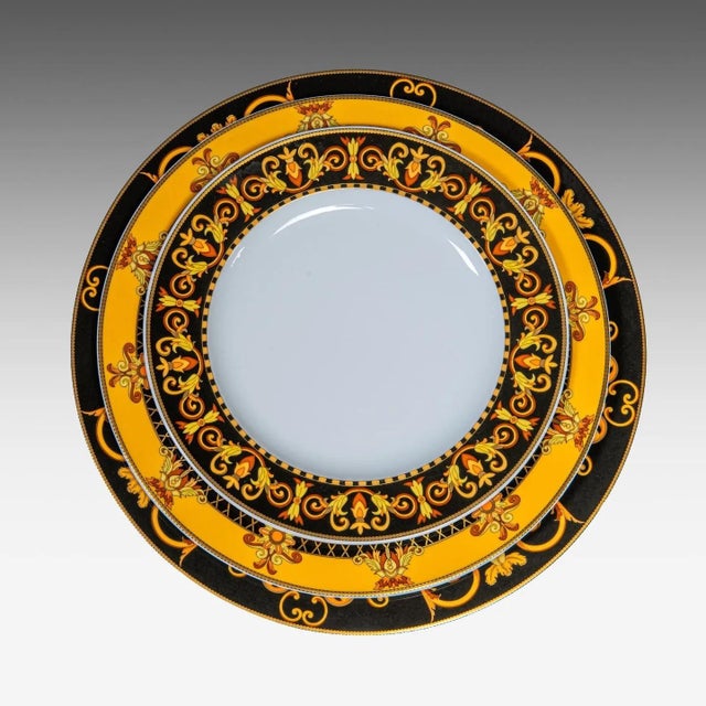 Important 70-piece dinner service by versace for rosenthal, barocco pattern, on the "ikarus" form designed by the german...