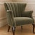 This elegant accent armchair embodies refined traditional craftsmanship with a soft contemporary sensibility, making it a...