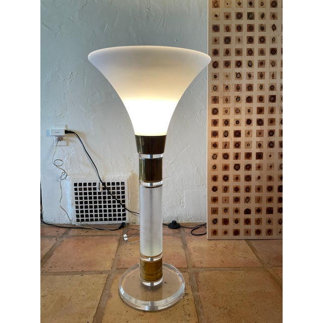 Stylish, striking and sculptural circa late 70s early 80s table lamp. Frosted glass column with gold plated metal bands...