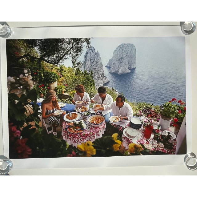 "Dining al Fresco on Capri" by Slim Aarons Unframed 30x40 size C-Print. Italian artist and actress Domiziana Giordano,...