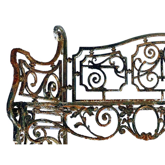 Antique early 20th century wrought iron garden bench. Distressed paint and rust finish. Please note: There is no seat (one...