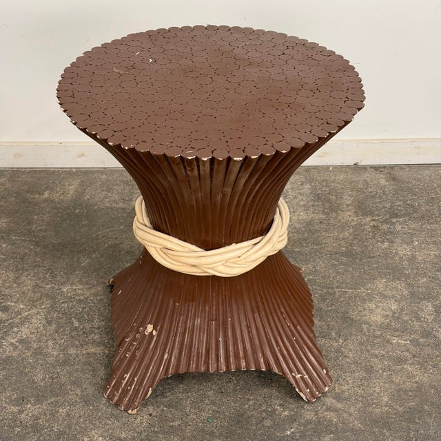 Regency style sheaf of wheat pedestal style table from the mid 20th century. The table is currently a warm brown with a...
