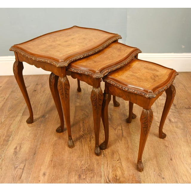 Superb quality set of three graduated nest tables by Harry & Lou Epstein Furniture Company. Crafted in beautifully figured...