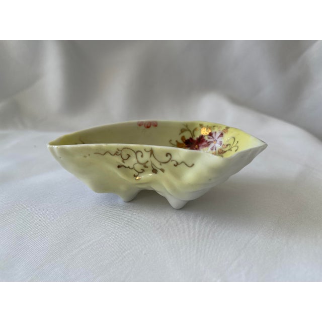 Antique hand painted French Belle Epoch style porcelain oyster shooter. This circa 1890 is decorated with delicate pink...