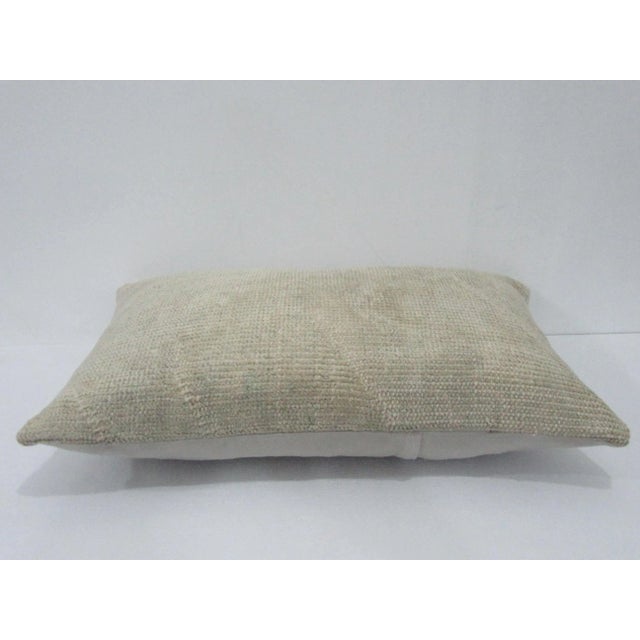 Decorative pillow cover made from a vintage Turkish handknotted rug. Backed with good quality cotton fabric. Pillow...