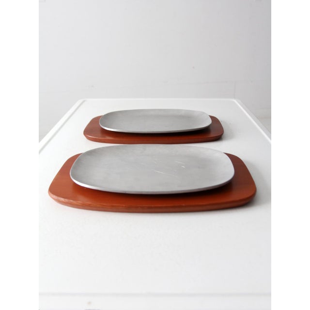 Add a touch of mid-century modern to your dining experience with this set of 1960s sizzler platters from AC Fabricators....