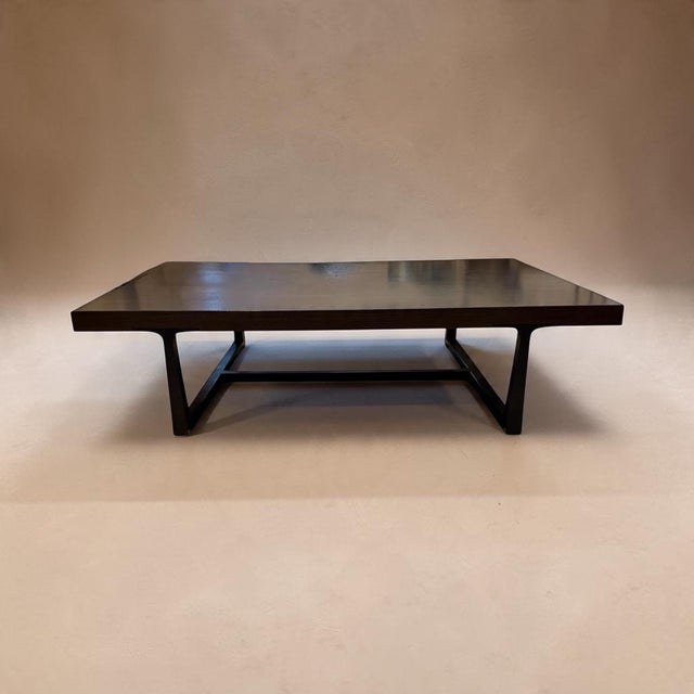 Large coffee table from the luxury furniture maker Holly Hunt. Substantial in size with a thick mahogany top and dark...