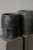 Crucibles — originally used for melting metals at high temperatures. Their dark, mineral surface is a direct result of use...