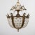A small 3-Light crystal glass chandelier, Spain circa 1950s. It has cut glass droplets arranged in a basket from a brass...