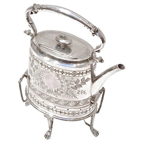 Antique Aesthetic Movement silver-plate kettle on a warming stand with leaf frond decorative chasing on the body face of...