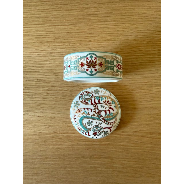 Authentic Tiffany & Co. porcelain trinket box with lid, made in Ireland. The lid has a hand-illustrated snake in teal, red...