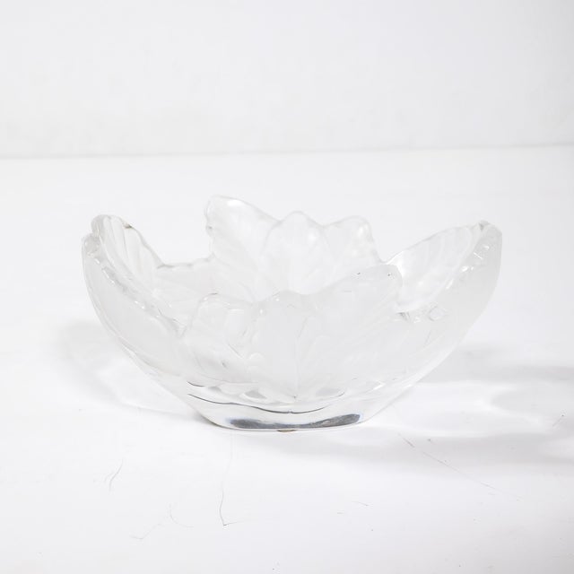 The Lalique "Compiegne" frosted and clear glass bowl, crafted in France circa 1950, is a stunning testament to the...