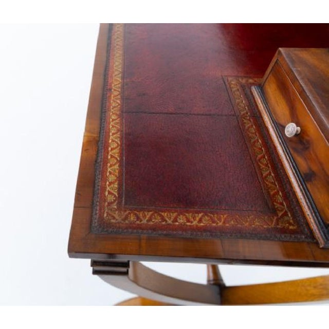 A charming Regency-style mahogany bonheur du jour, elegantly designed and finely crafted, offering both practicality and...